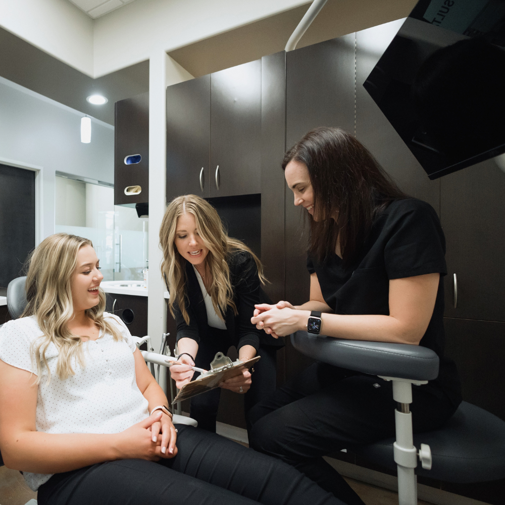 Treatment Coordinator, hygienist and patient talking